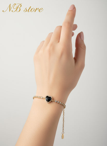bellissimi bracciali color oro con brillantini con cuore al centro
