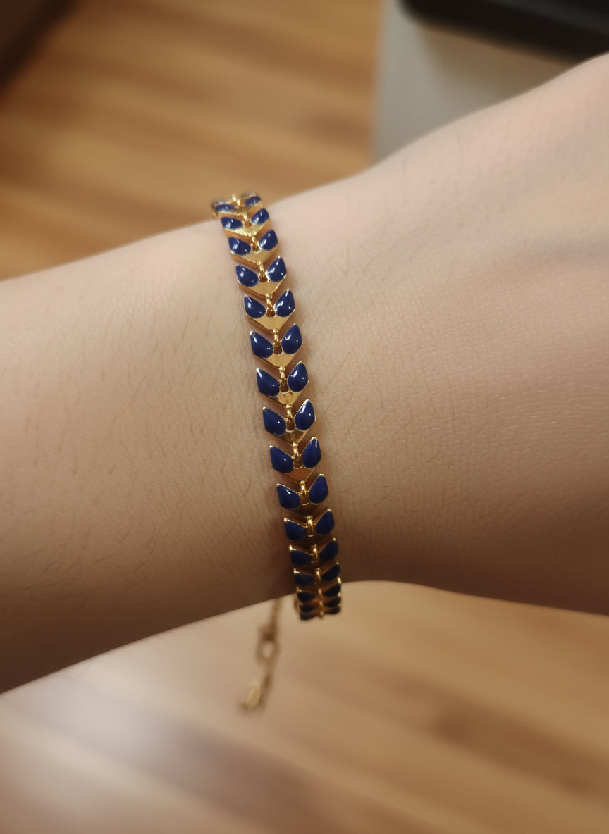 bracciale dorato con foglie rosse- blu